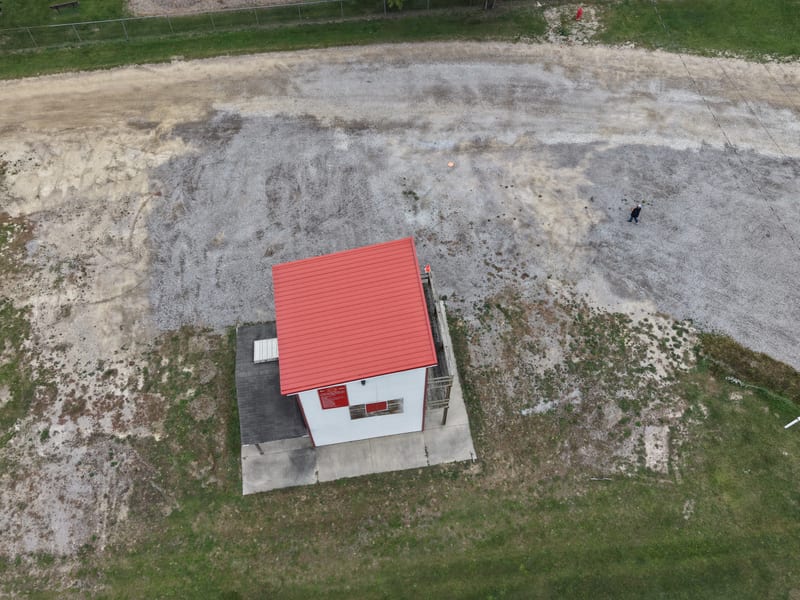 Overhead aerial of red-roof building